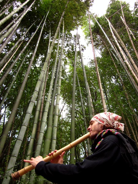 Jon Kypros playing shakuhachi at a madake bamboo grove, 2010. 
